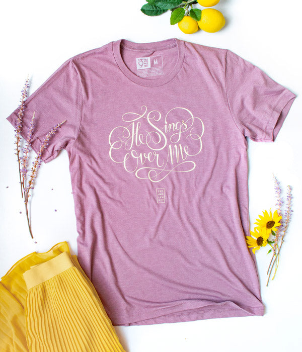 He Sings Over Me Tee – Heather Orchid