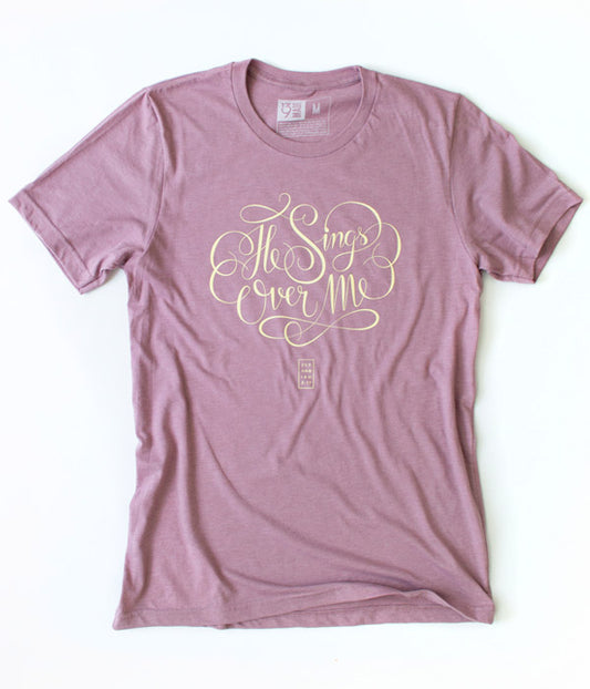 He Sings Over Me Tee – Heather Orchid